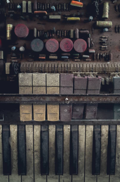istock The piano vintage with electronic dilapidated in storage room 1177160272