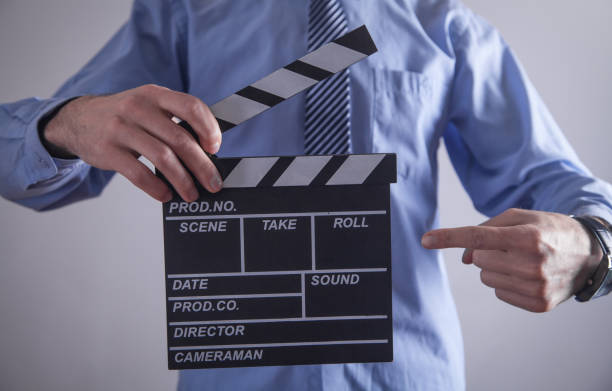 istock Man holding movie clapper. Making movie 1177161185