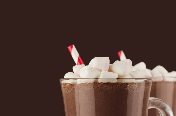exquisite chocolate dessert with marshmallows and red striped straw closeup, details, top section on dark brown background, copy space. - hot chocolate hot drink high section close up imagens e fotografias de stock
