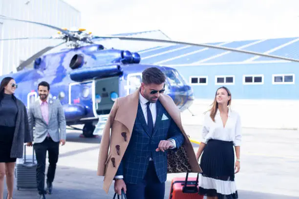 Photo of Business people ready to travel by helicopter