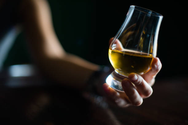 istock Hand holding a Glencairn whisky glass 1177162942