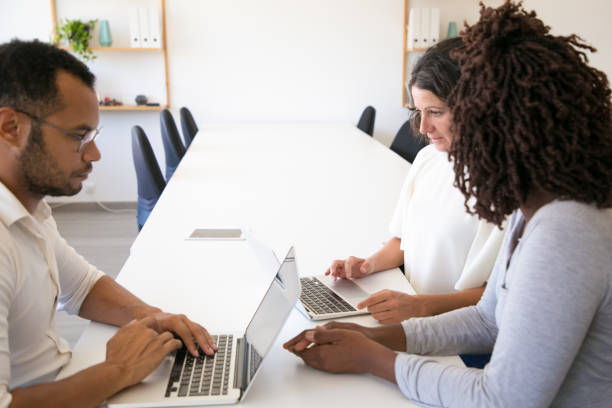 istock Serious diverse business colleagues meeting and working 1177164362