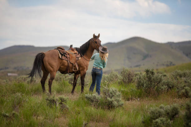 istock Cowgirl Horseback Riding 1177168637