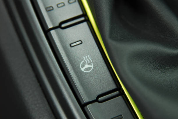 istock steering wheel heating button in the car 1177168832