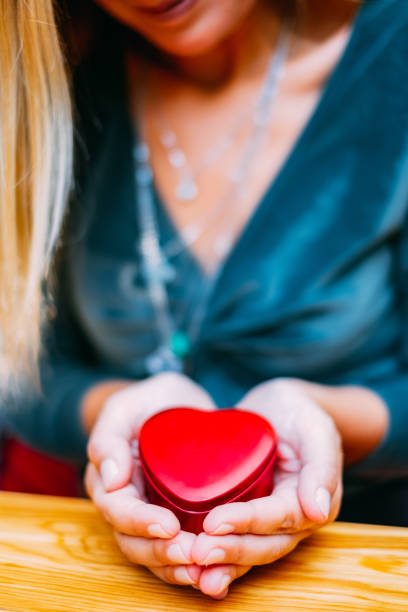 Woman Holding Heart Shaped Box