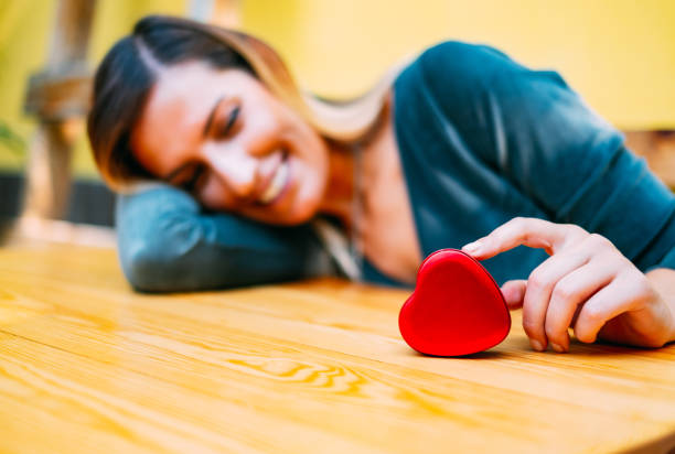 Beautiful Woman Holding Heart Shaped Box
