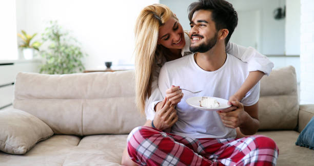 istock Cute young cheerful couple spending time at home 1177174562