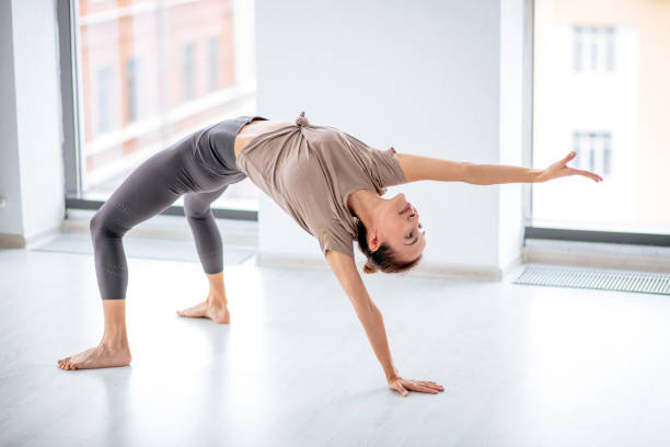 istock woman doing stip plastic. full length side view photo. gracefulness concept 1177174834