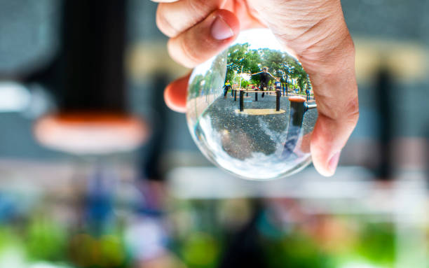 istock Child playing in park  through the lensball 1177174915