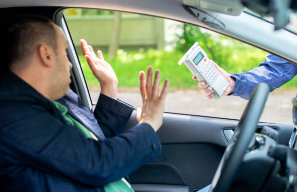 Driver due to being subject to test for alcohol content with use of breathalyzer stock photo
