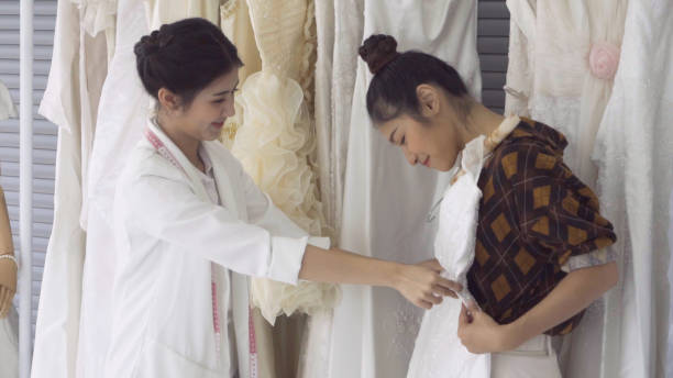istock Future bride customer talking with wedding store shopkeeper 1177176274