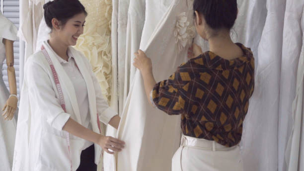 istock Future bride customer talking with wedding store shopkeeper 1177176301