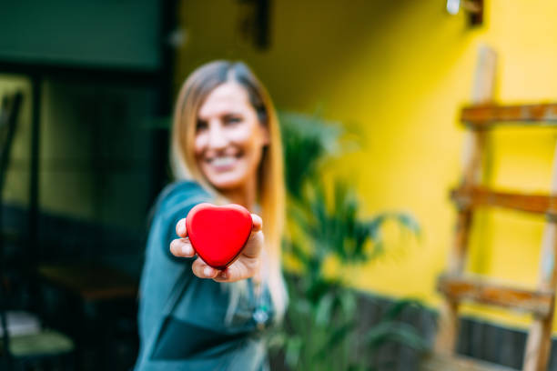 Beautiful Woman Holding Heart Shaped Box