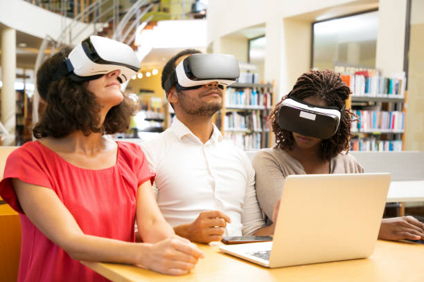 istock Diverse team of adult students using VR technology for work 1177176492