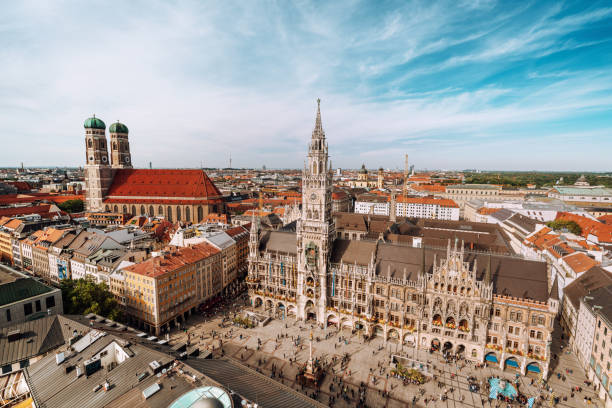 panorama of marienplatz square with new town hall and frauenkirche (cathedral of our lady). - sunlight sun architectural feature blue imagens e fotografias de stock