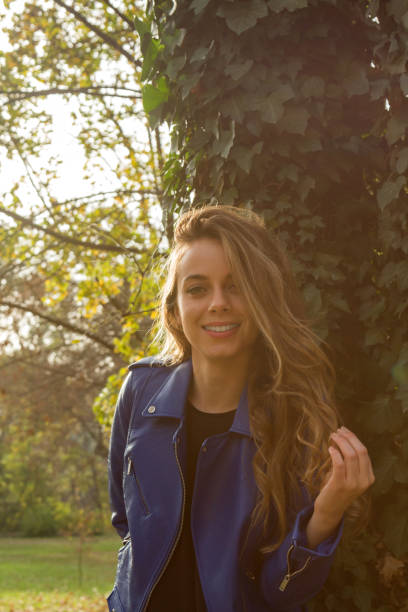 istock Young woman posing in nature at autumn / fall time. 1177177531