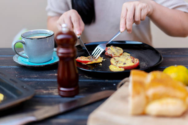 istock homemade healthy breakfast: baked tomato slice with egg and bacon 1177185725
