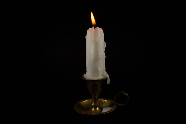 istock Burning wax candle in a vintage brass candlestick 1177187088