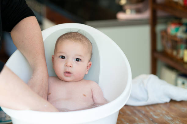 istock Adorable mixed-race baby takes a bath 1177188349