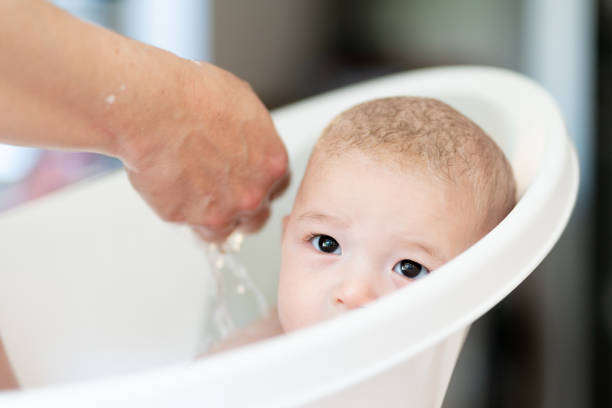 istock Adorable mixed-race baby takes a bath 1177188368