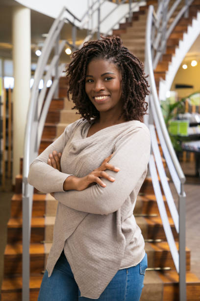 istock Beautiful African American woman posing at library 1177193930