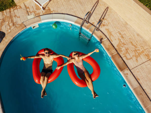 istock Couple relaxing in a swimming pool 1177194017