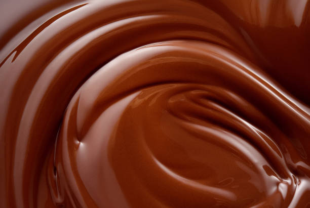 istock Chocolate background. Melted chocolate surface. Chocolate swirl. 1177198502