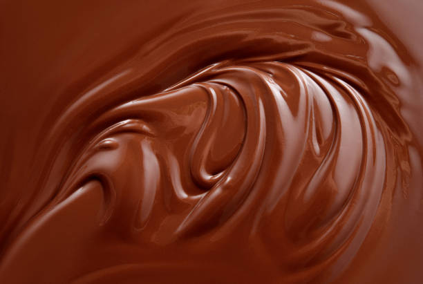 istock Chocolate background. Melted chocolate surface. Chocolate swirl. 1177198536