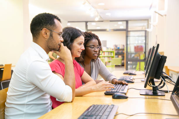 istock Diverse team of adult students working together 1177198927