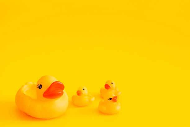 istock Yellow rubber duck isolated on a yellow background. 1177202550