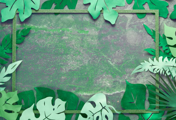 istock Paper craft background, frame with exotic tropical leaves with text space on dark 1177203615