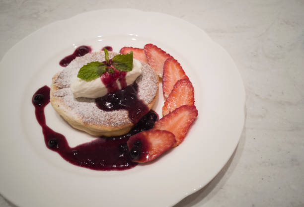 istock souffle pancake with slice strawberries and whip cream 1177209794