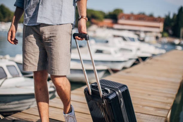 istock Man with luggage on pier 1177209870