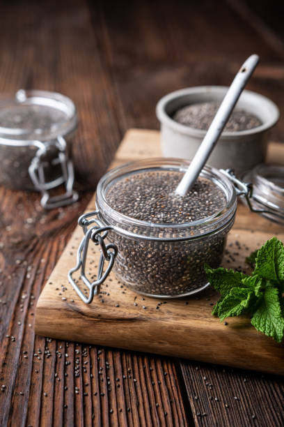 Easy to digest chia seed gel rich in calcium and dietary fiber in a glass jar stock photo