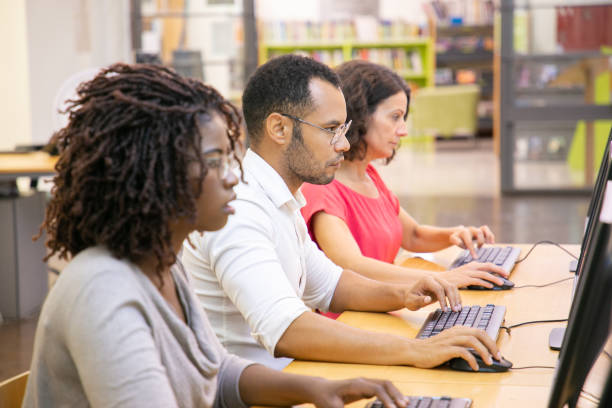 istock Diverse group of adult students working in computer class 1177214140