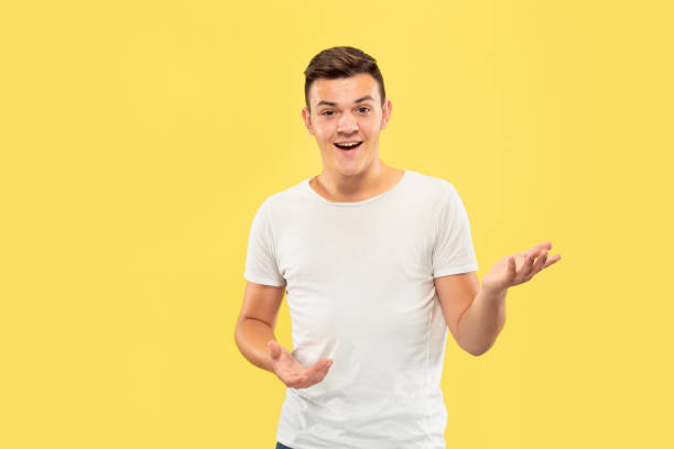 istock Caucasian young man's half-length portrait on yellow background 1177215939