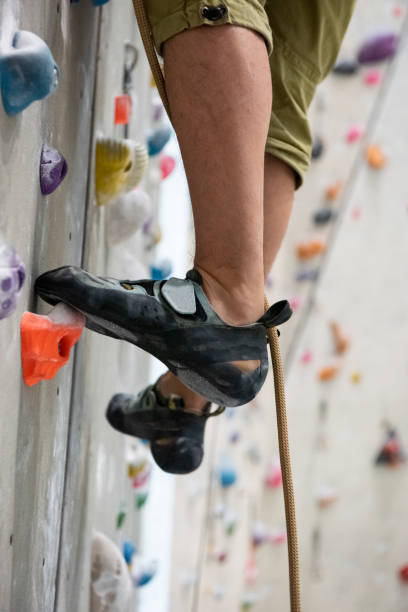 istock Unrecognizable climber's shoe on climbing wall 1177216341