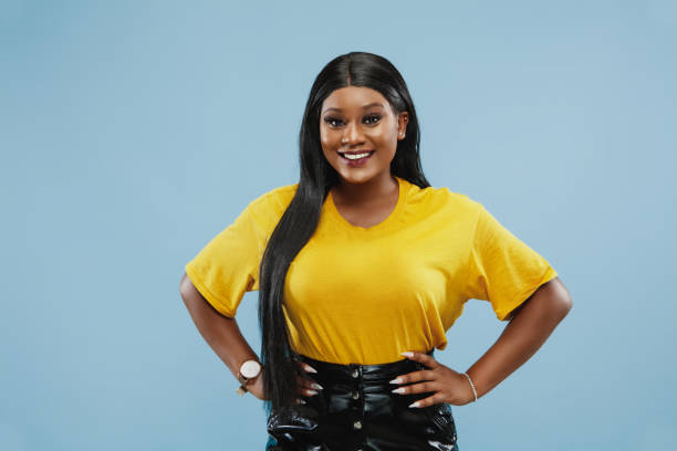 istock African-american young woman's half-length portrait on blue background 1177218071
