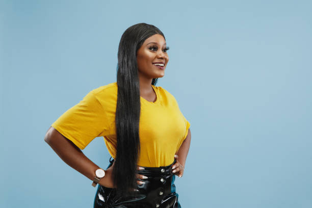 istock African-american young woman's half-length portrait on blue background 1177218103