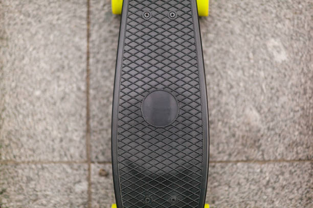 istock black skateboard stands on the sidewalk. close-up 1177218871
