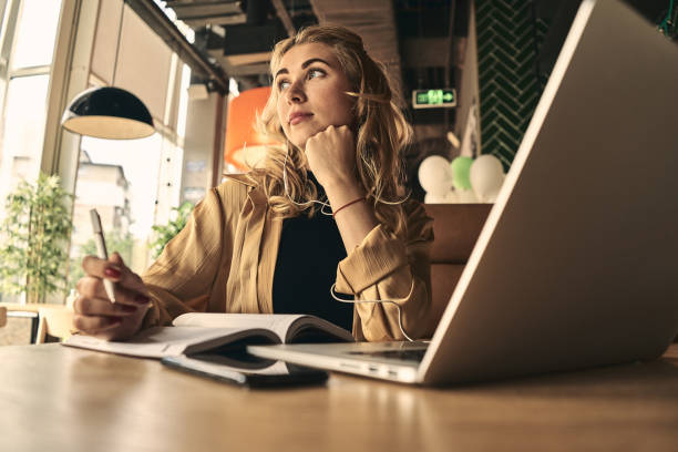 istock Happy young caucasian business woman entrepreneur using computer looking at screen working in internet sit at office desk, smiling female professional employee typing email on laptop at cafe. 1177222880