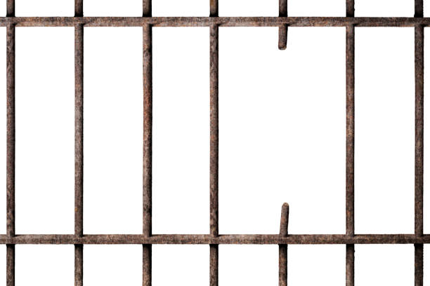istock Prison cell with broken old prison bars isolated on white, way out to freedom 1177222996