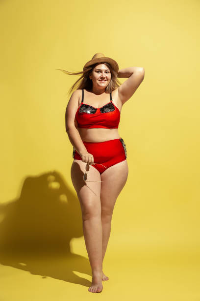 istock Young caucasian plus size female model's preparing for beach resort 1177225144