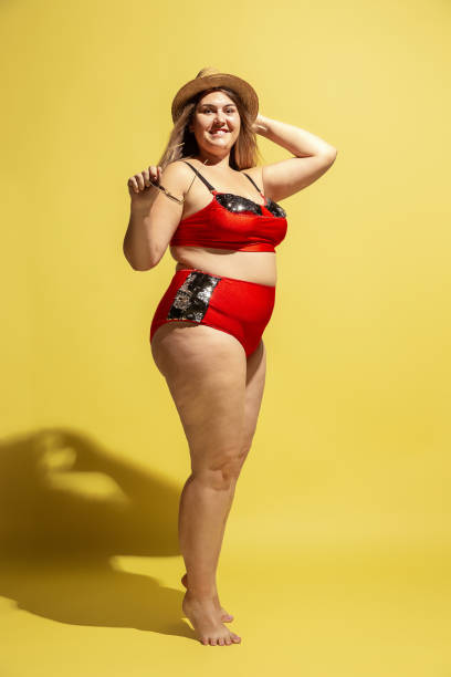 istock Young caucasian plus size female model's preparing for beach resort 1177225222