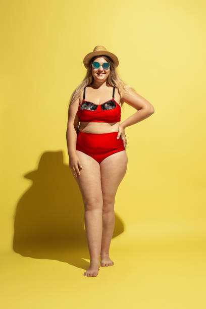 istock Young caucasian plus size female model's preparing for beach resort 1177225252