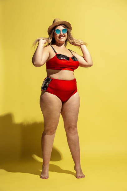 istock Young caucasian plus size female model's preparing for beach resort 1177225258