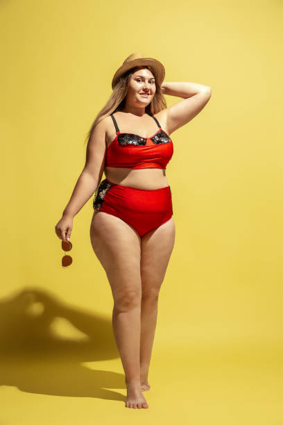 istock Young caucasian plus size female model's preparing for beach resort 1177225259