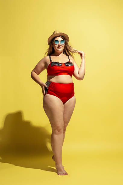 istock Young caucasian plus size female model's preparing for beach resort 1177225264