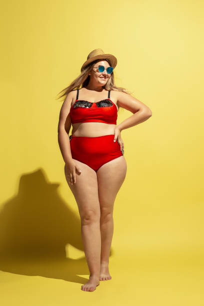 istock Young caucasian plus size female model's preparing for beach resort 1177225266
