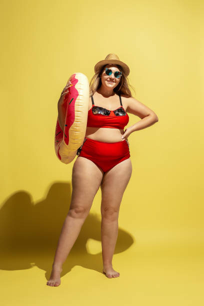 istock Young caucasian plus size female model's preparing for beach resort 1177225267